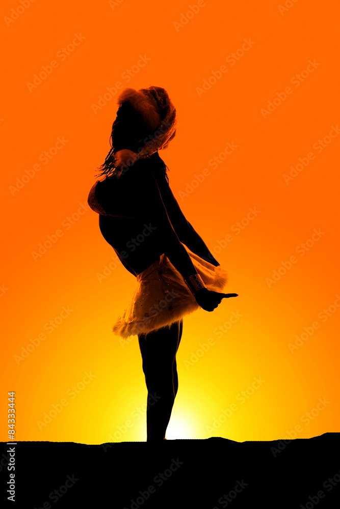 silhouette of woman in white santa outfit side skirt back