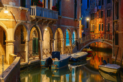 Night lateral canal and bridge in Venice, Italy