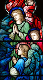 Praying angels in a stained glass window