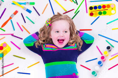 Littel girl with school art supplies