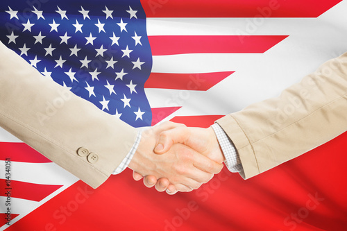 Businessmen handshake - United States and Poland