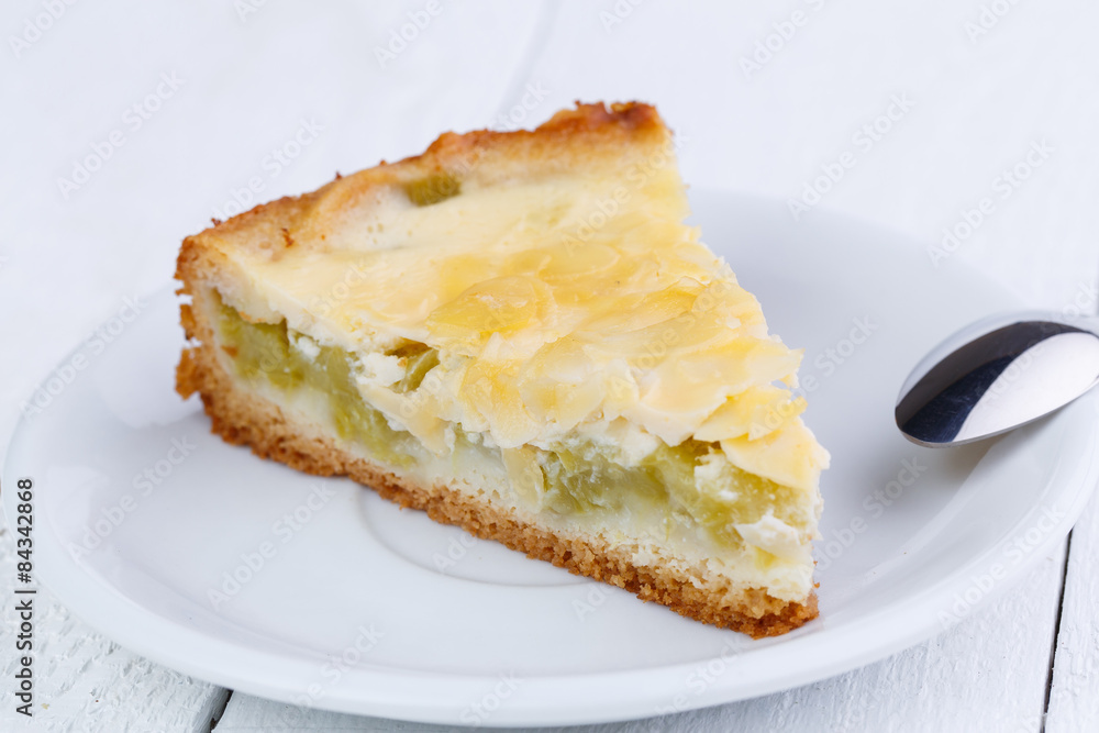 Slice of rhubarb pie on wooden table. Slice of rhubarb pie on wooden table.