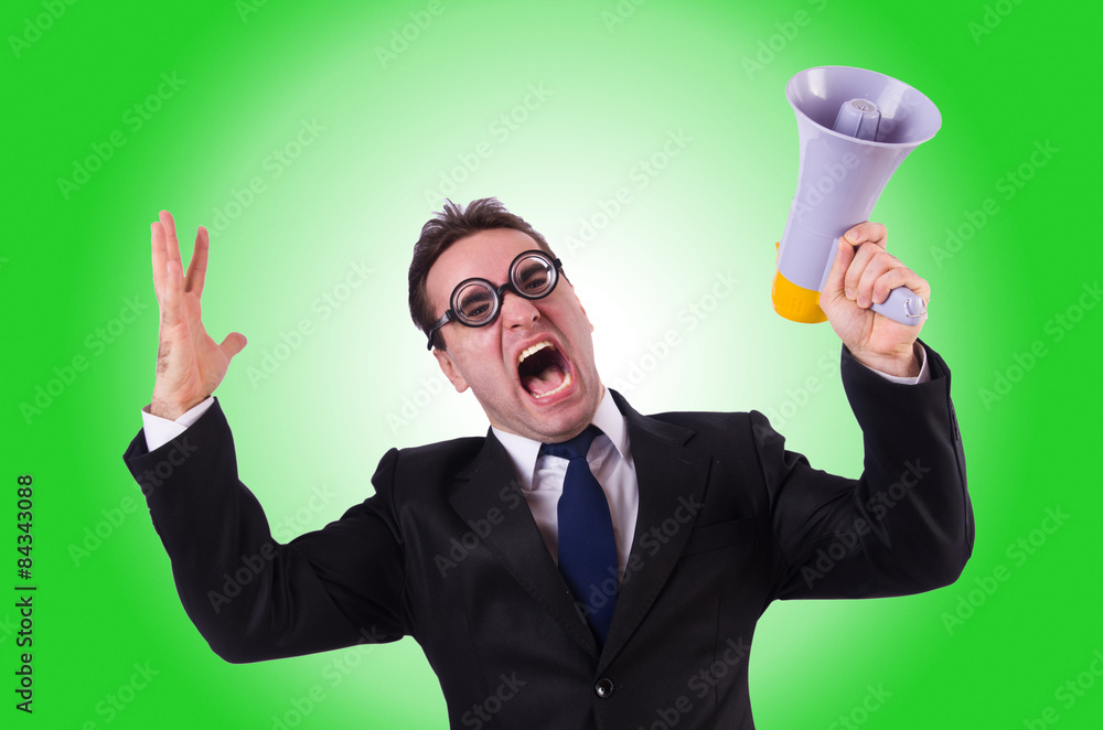 Young businessman with loudspeaker on white Young businessman with loudspeaker on white