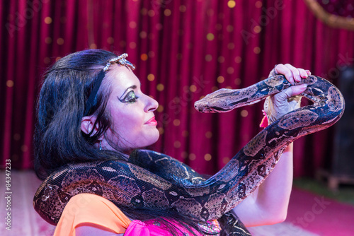 Exotic Dancer Face to Face with Snake on Stage