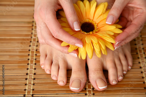 Care for beautiful woman legs with flower photo