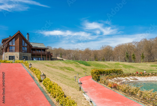 Modern house in bright summer day photo