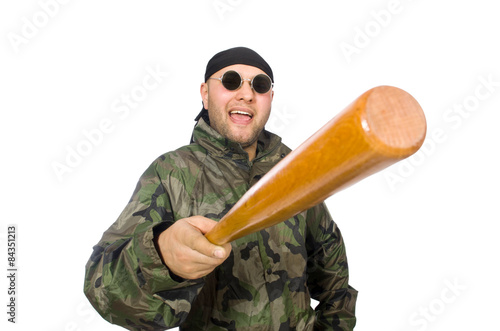 Young man in soldier uniform holding bludgeon isolated on white