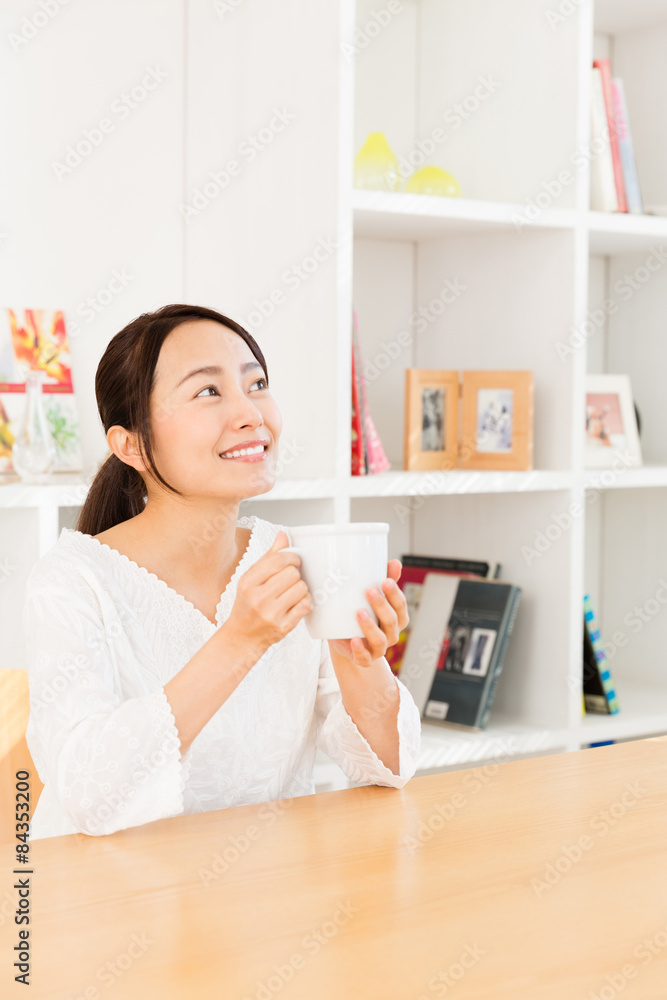 young asian woman relaxing in living room