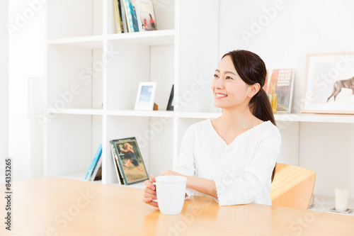 young asian woman relaxing in living room