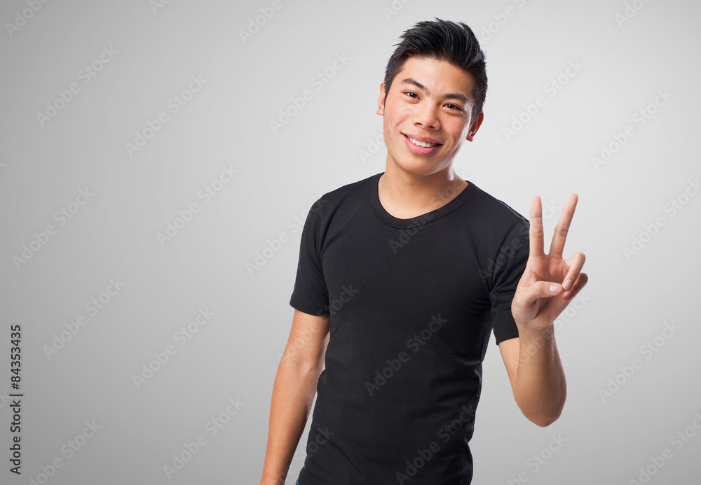 chinese man doing a victory sign chinese man doing a victory sign