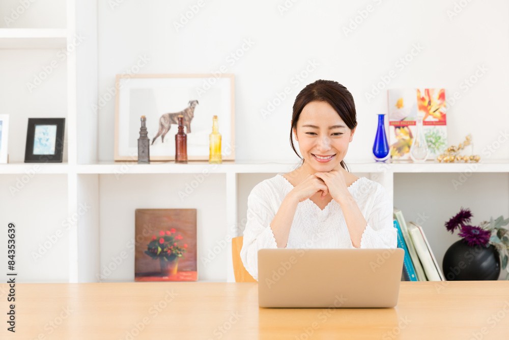young asian woman relaxing in living room
