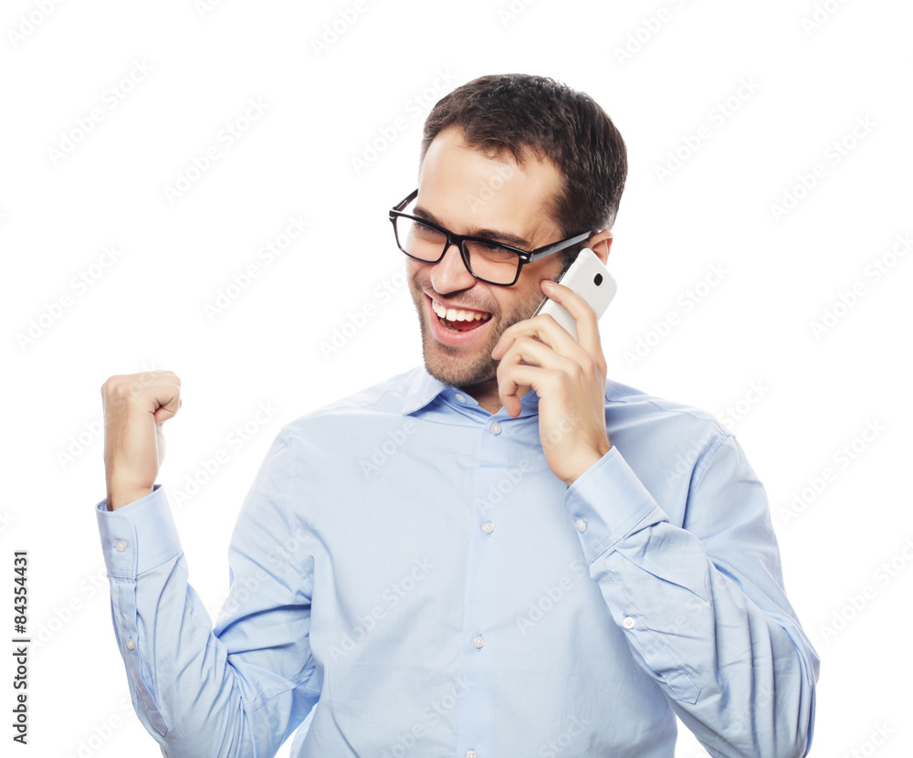Successful gesturing business man with mobile Successful gesturing business man with mobile