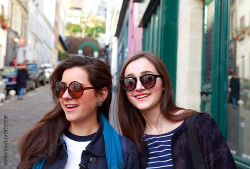 Close-up portrait of beautiful girls in the city