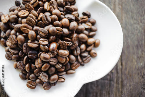coffee beans on wooden background.