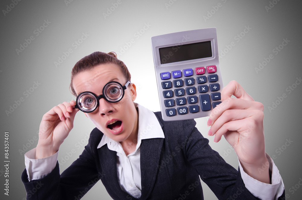 Nerd female accountant with calculator Nerd female accountant with calculator