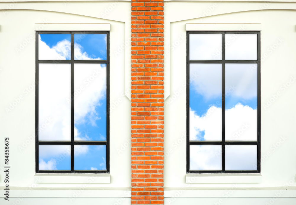 Fototapeta premium house window with brick post and reflection of nice blue sky