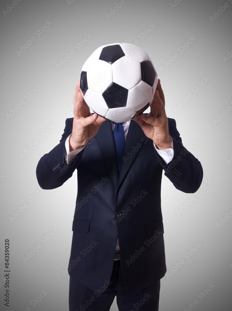 Businessman with football on white Businessman with football on white