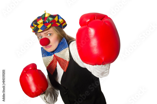 Pretty female clown with box gloves isolated on white © Elnur