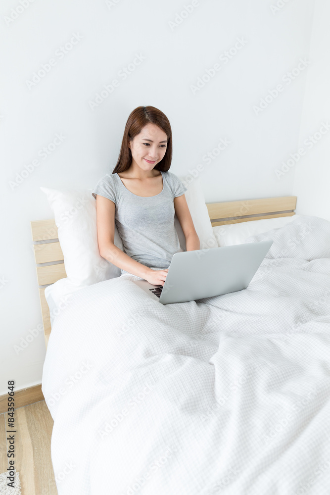 Young woman use of notebook computer at home Young woman use of notebook computer at home