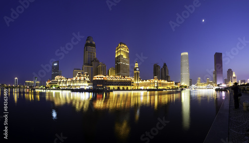 modern buildings at riverbank © zhu difeng