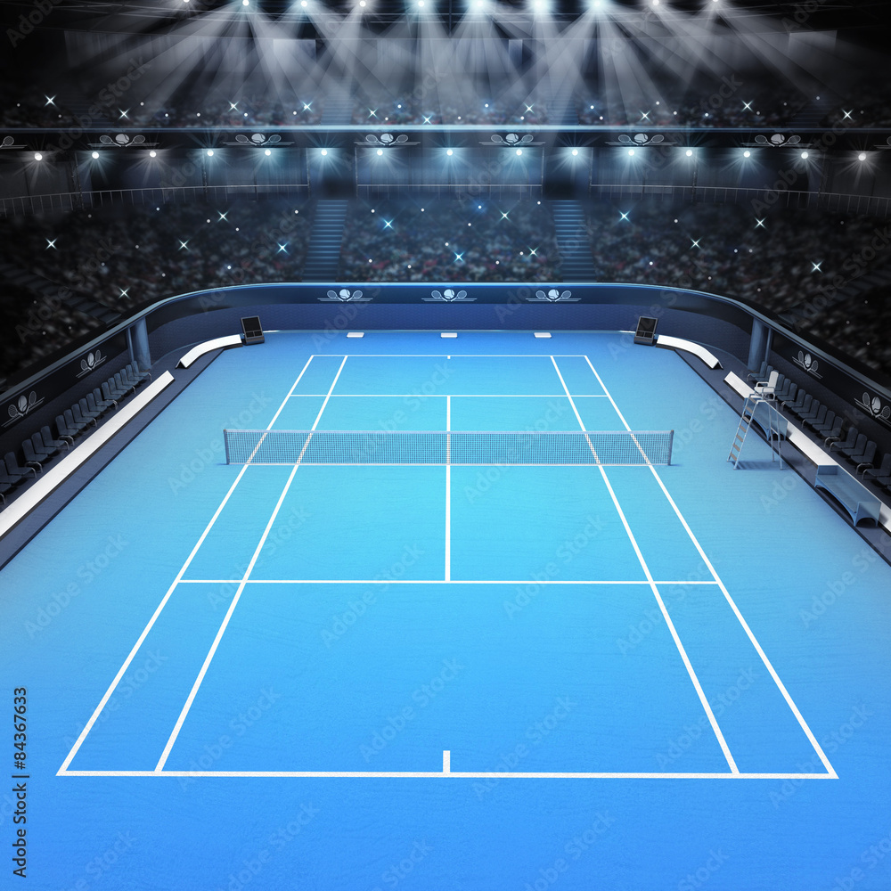 blue hard surface tennis court and stadium full of spectators Stock