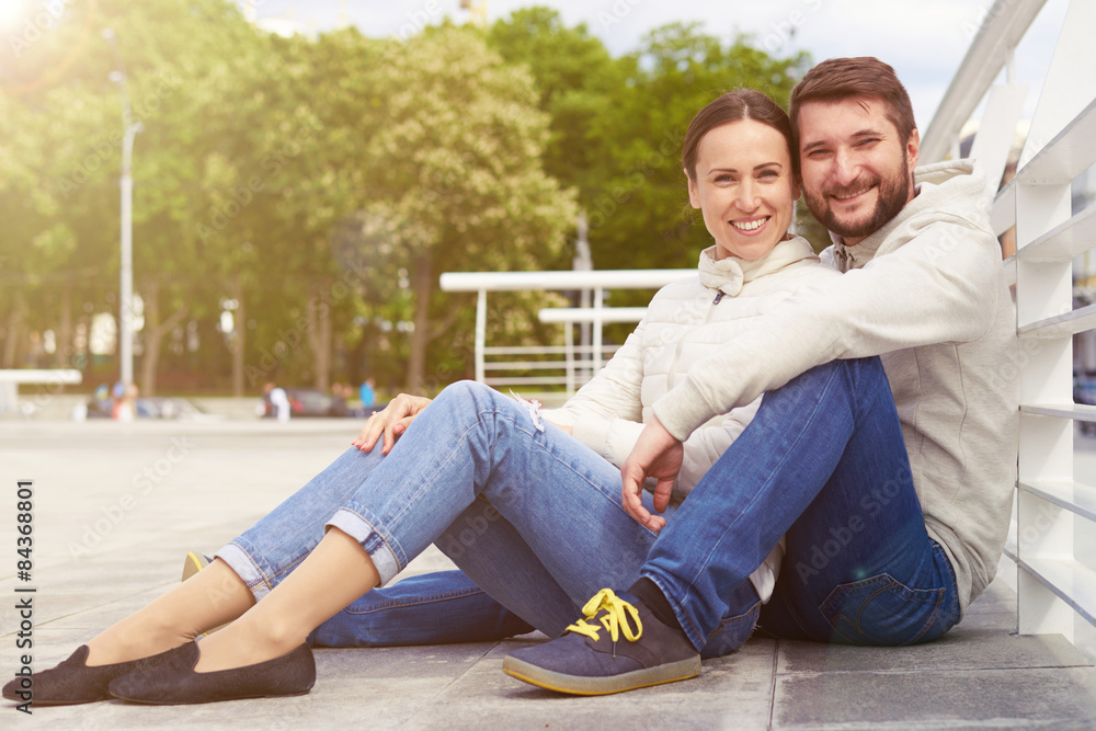 couple sitting and looking at camera couple sitting and looking at camera