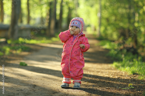 cheerful child walks in the park