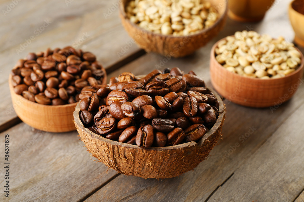 Fototapeta premium Various of coffee in small dishes on wooden table, closeup