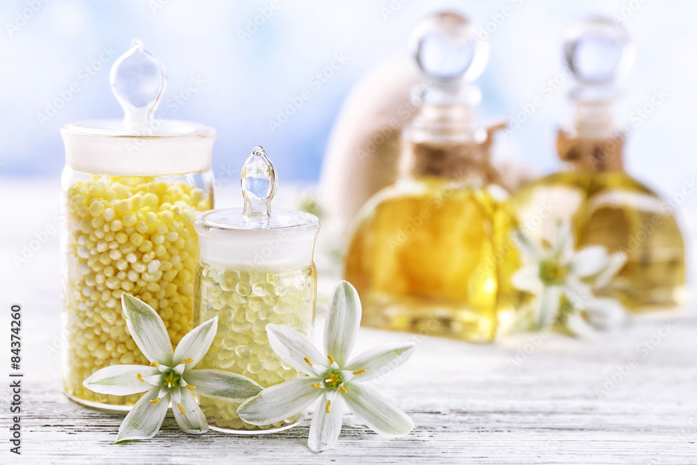 Spa treatment and flowers on light background Spa treatment and flowers on light background