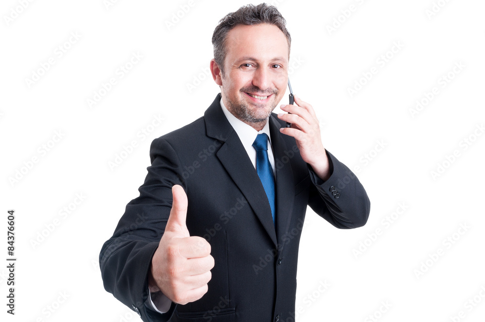 Busy and confident business man showing thumb up Busy and confident business man showing thumb up