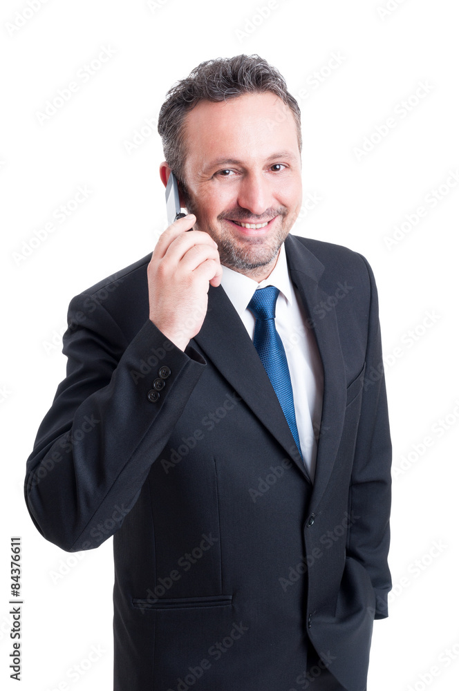 Smiling and successful business man talking on the phone Smiling and successful business man talking on the phone