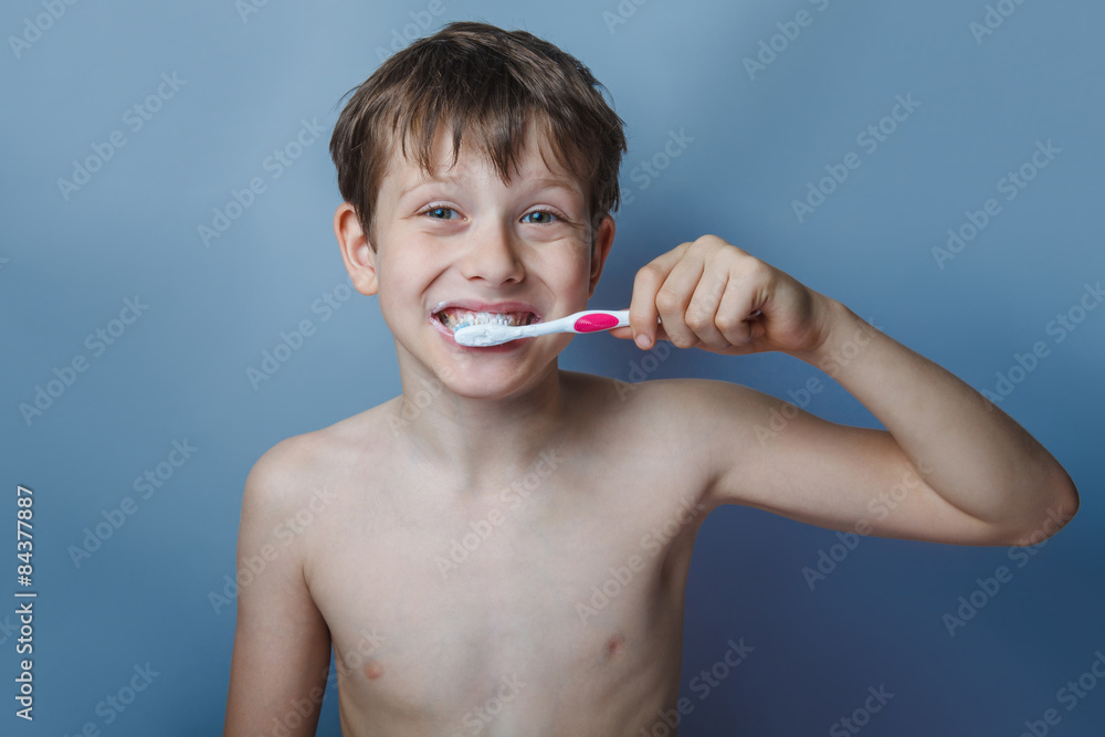 a boy of 10 years of European appearance naked torso brushing he a boy of 10 years of European appearance naked torso brushing he