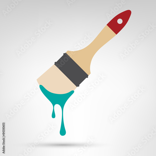 Paint brush with wooden handle and dripping paint
