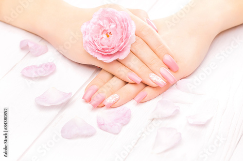 french manicure with rose flowers. spa