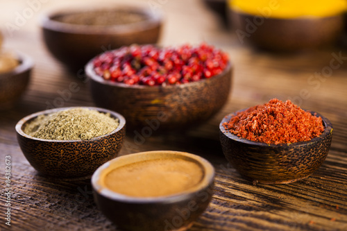 Fototapeta Naklejka Na Ścianę i Meble -  Spices and herbs in wooden bowls