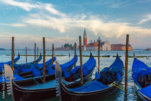 Gondolas at twilight in Venice lagoon, Italia © Kavalenkava
