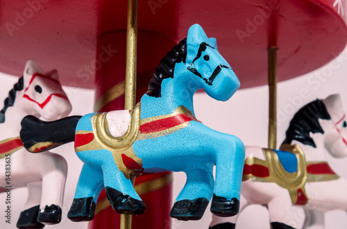 Blue horse carousel, spinning toy, close up