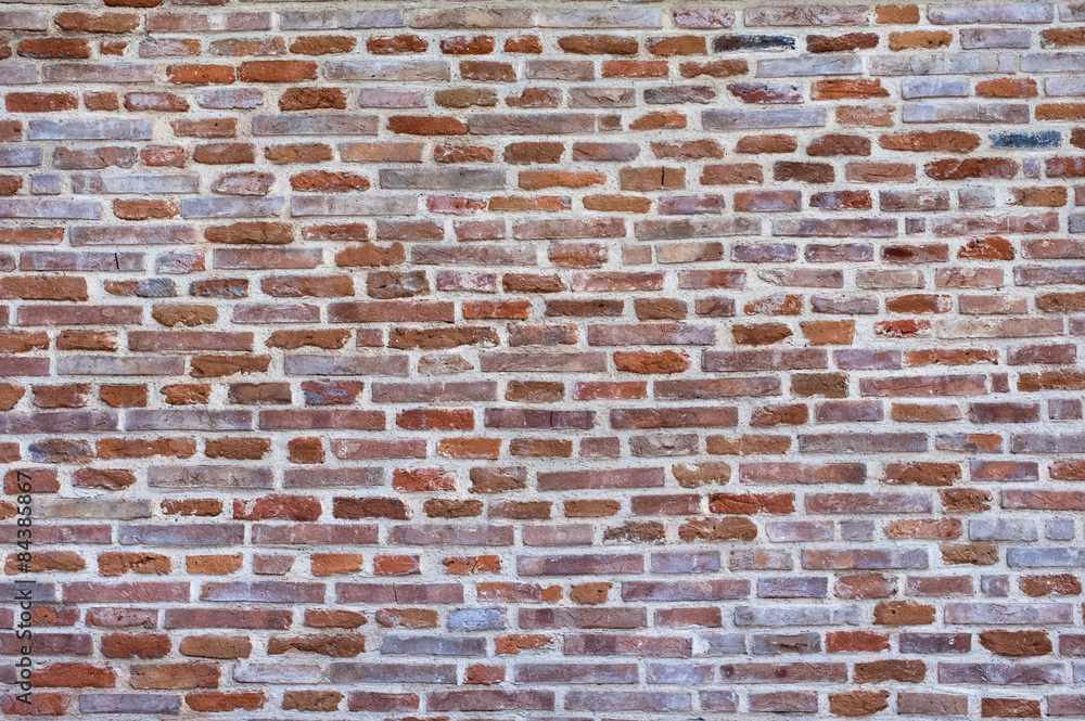 Naklejka premium Brick wall background. Customizable brick wall texture background, front view.