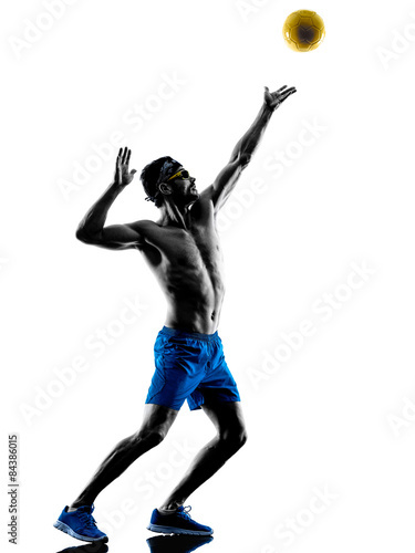 Fototapeta man playing beach volley silhouette