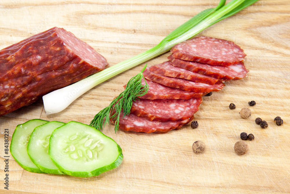 salami sausages on wooden board isolated salami sausages on wooden board isolated