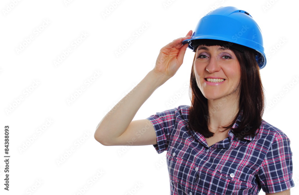 Smiling builder woman wearing protective blue helmet