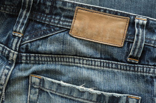 Foto jeans pants with back pocket and brown leather tag