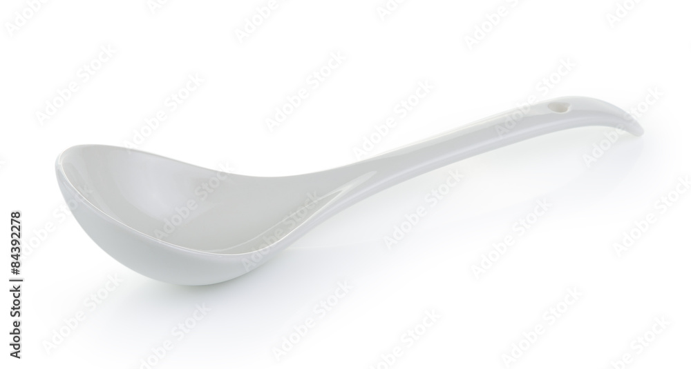 White empty ceramic spoon on white background White empty ceramic spoon on white background