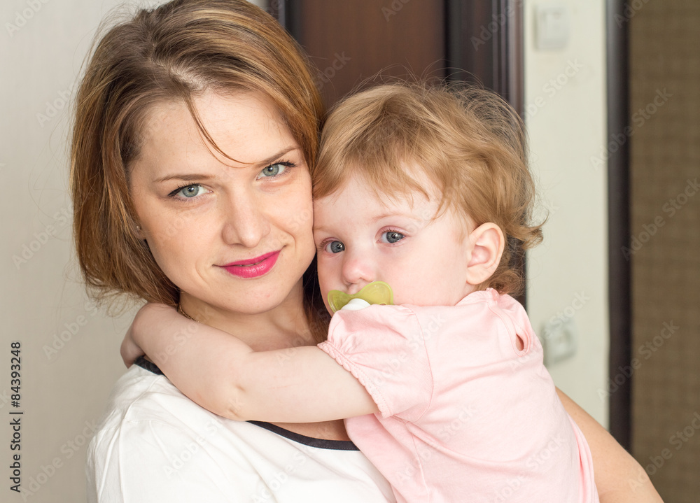Mother soothes the baby Mother soothes the baby