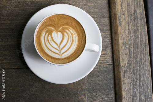 Latte coffee in white mug top view