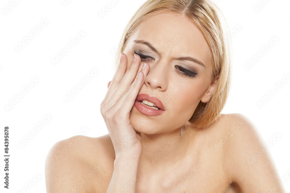 young beautiful woman has a toothache young beautiful woman has a toothache