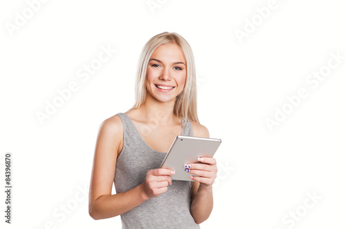 Woman using digital tablet computer happy isolated on white