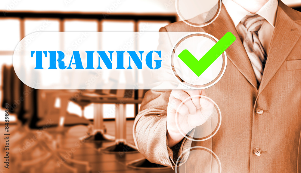 Businessman pressing touch screen interface training checkbox Businessman pressing touch screen interface training checkbox