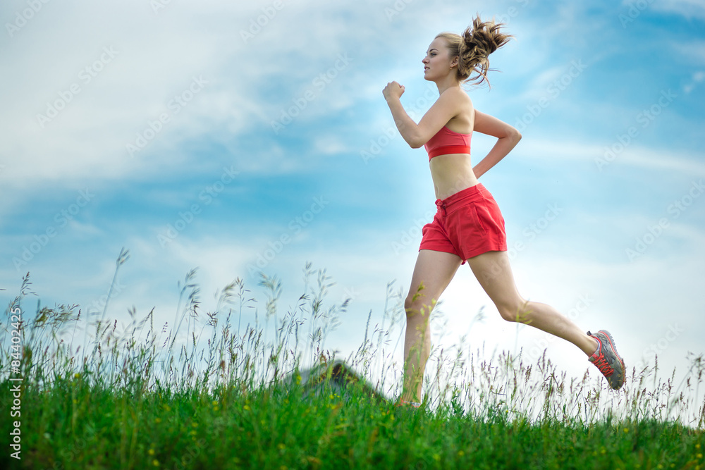 Young woman running summer park rural road. Outdoor exercises. J Young woman running summer park rural road. Outdoor exercises. J
