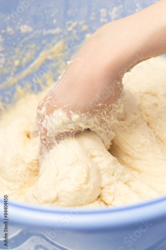 Making dough by female hands